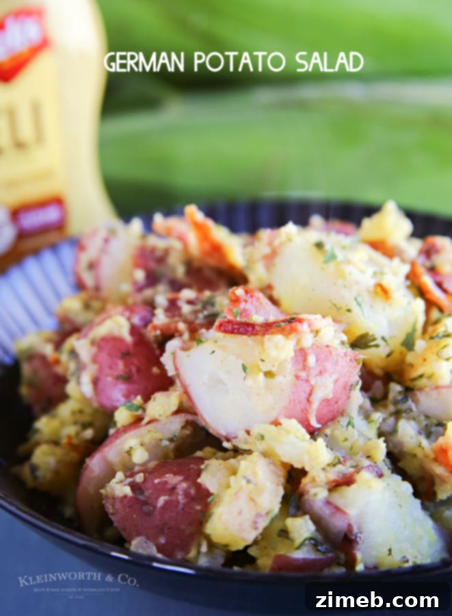 German Potato Salad Recipe with chives and parsley, ready to serve warm.