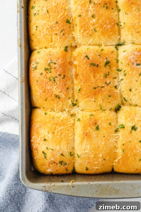 Garlic Parmesan Dinner Rolls in 30 Minutes 13 A close-up of 30-Minute Holiday Rolls, golden brown and perfectly baked.