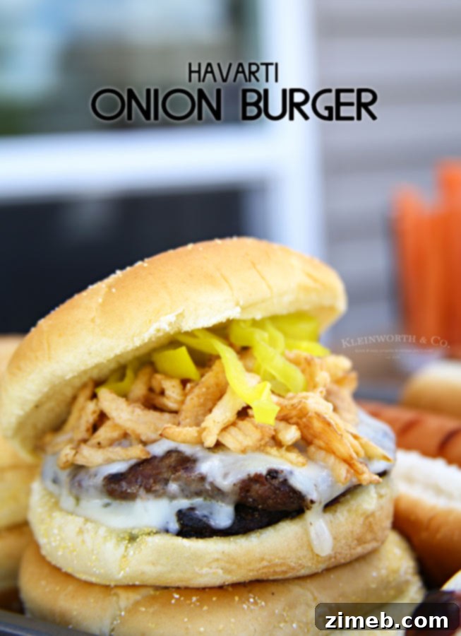Caramelized Onion Havarti Burger 7 Havarti Onion Burger, showcasing melted cheese and crispy onions.