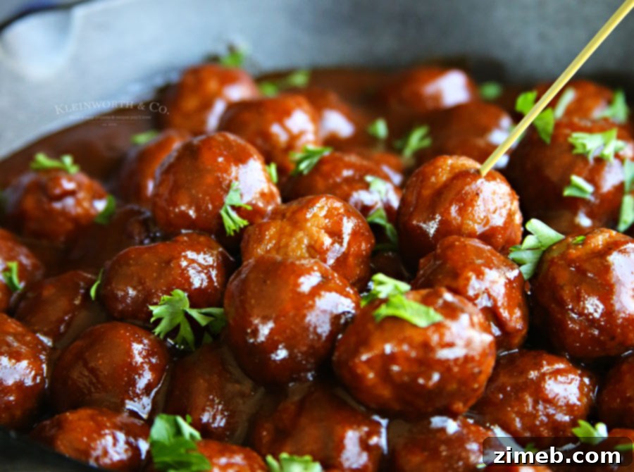 Kicky BBQ Ale Meatballs recipe simmering in a pot, ready for serving