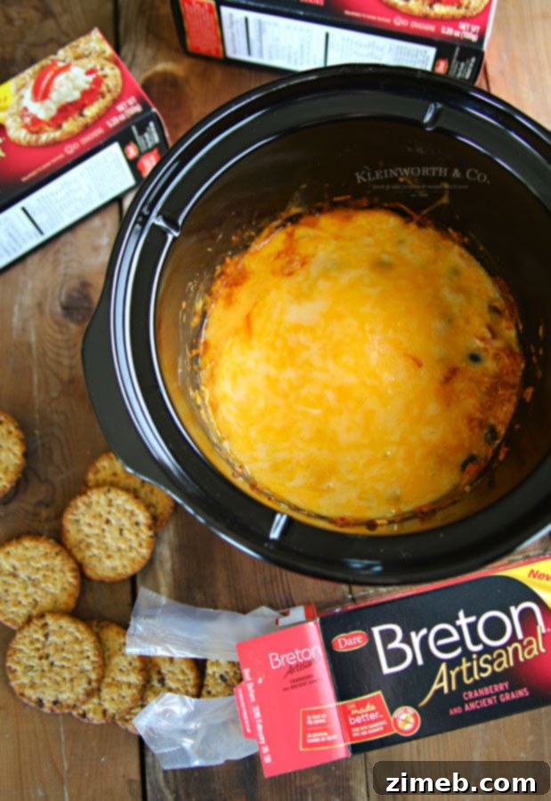 Simple and easy Slow Cooker Fiesta Cheese Dip recipe for stress-free entertaining.