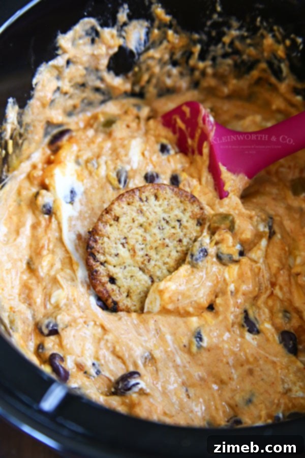 Creamy Slow Cooker Fiesta Cheese Dip for parties and casual gatherings, served hot.