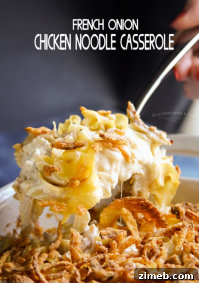 Golden French Onion Chicken Noodle Bake 5 French Onion Chicken Noodle Casserole with a serving spoon