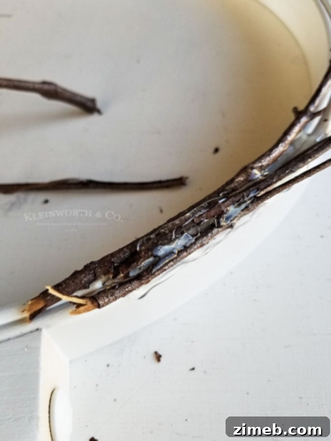 Spooky Raven Halloween Wreath - attach twigs to painted hoop