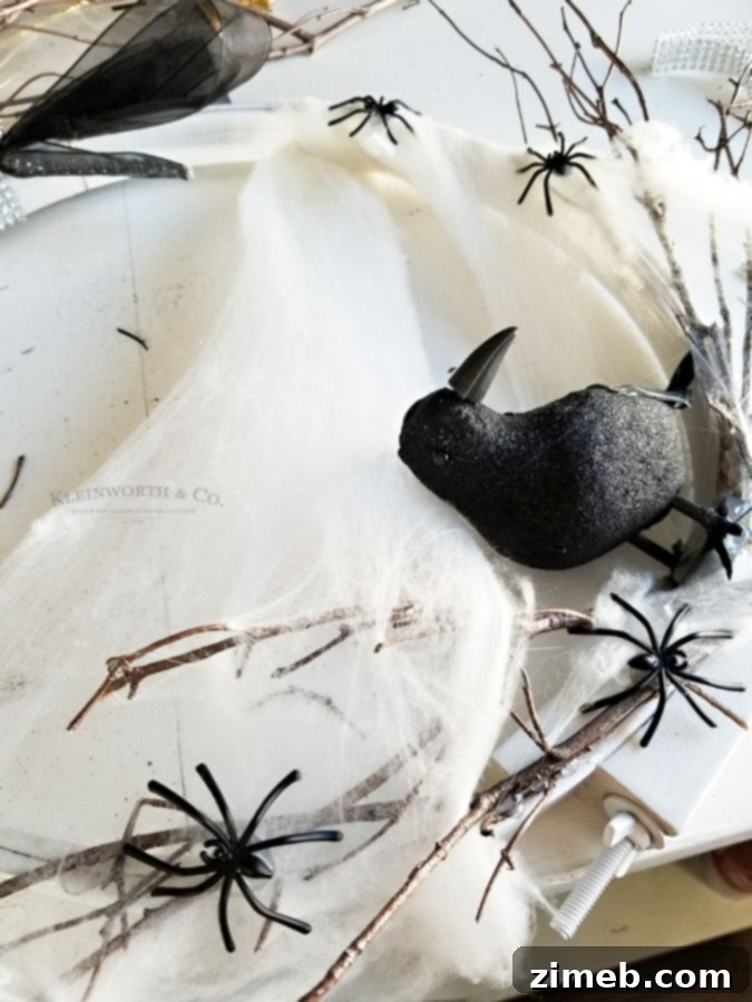 Spooky Raven Halloween Wreath - attach plastic spiders