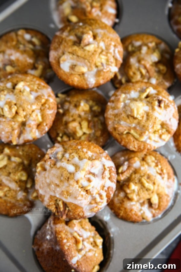 Close-up of fluffy Sweet Potato Muffins, showcasing their rich texture and golden-brown tops.
