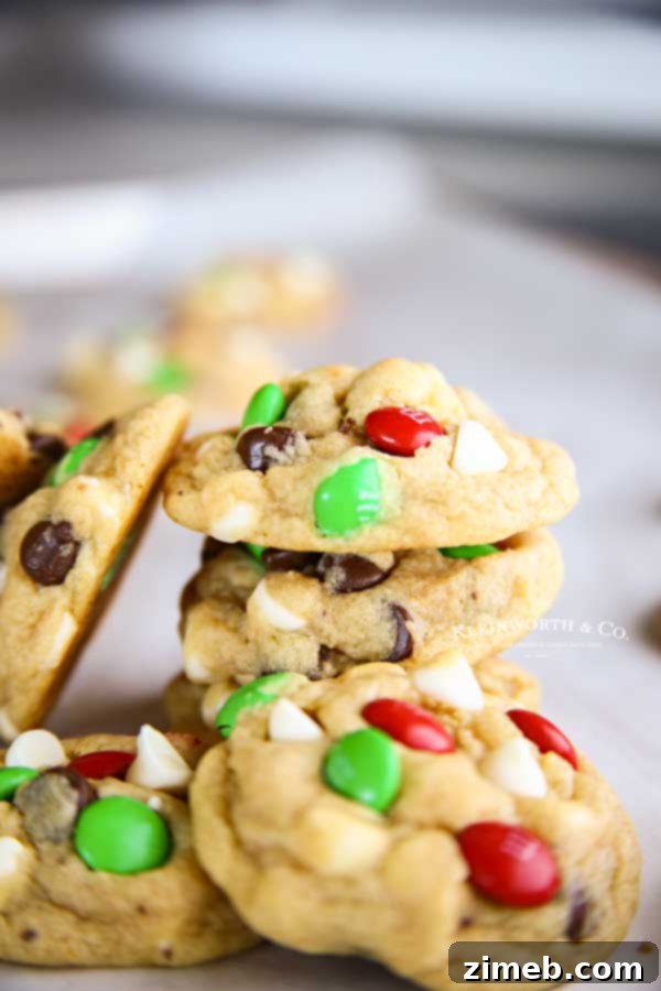 Scooping dough for Santa's Favorite Chocolate Chip Cookies onto a baking sheet.