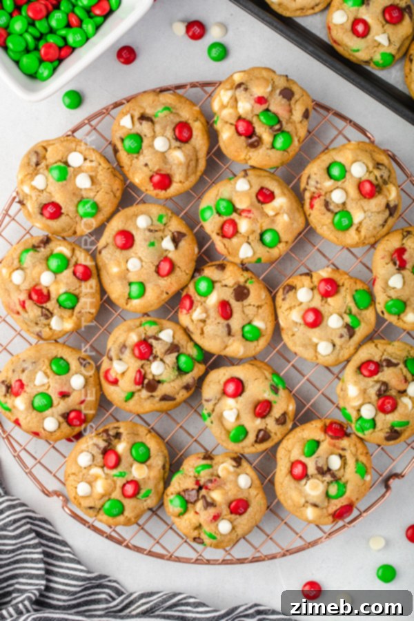 A stack of perfectly baked Santa’s Favorite Chocolate Chip Cookies on a festive background.
