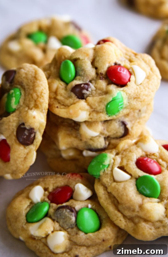 A festive platter piled high with Santa's Favorite Chocolate Chip Cookies and other holiday treats, perfect for sharing.