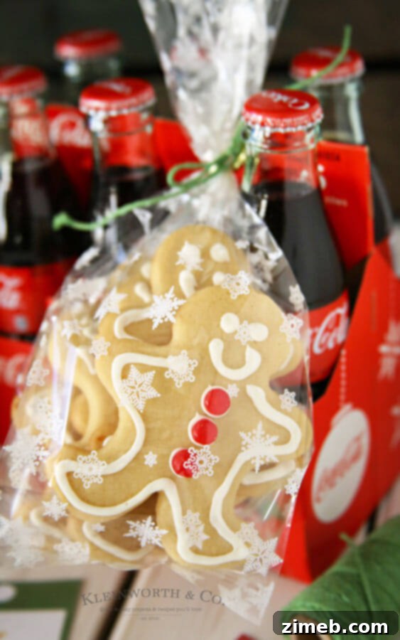 Foolproof Sugar Cookies 3 Delightful sugar cookies decorated with red hots and icing, perfect for gifting.