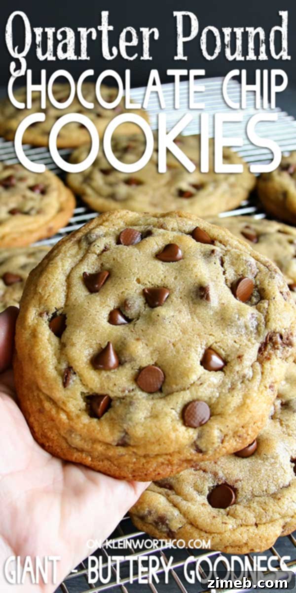 Gourmet Giant Chocolate Chip Cookies 5 An array of Quarter Pound Chocolate Chip Cookies displayed on a wooden surface, highlighting their rich color and inviting texture.