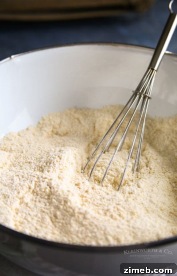 Homemade Golden Corn Muffin Mix 3 Close-up of corn muffin mix being prepared in a bowl