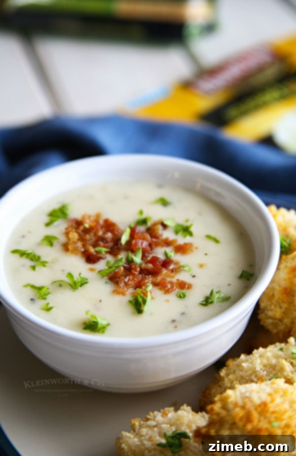 Golden Crispy Chicken Tenders with Hearty Potato Soup 3 A steaming bowl of creamy potato soup, perfect for pairing with crispy chicken tenders.