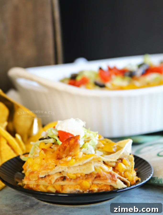 Creamy Southwest Chicken Casserole 4 Chicken Casserole layers with tortillas, beans, chicken, and sauce before baking