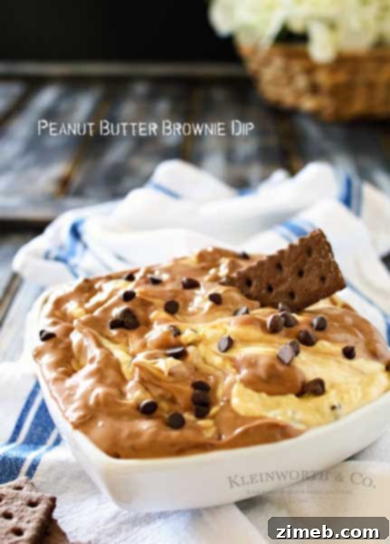 Decadent Oreo New York Cheesecake 6 Peanut Butter Brownie Dip is a delicious dessert made of blended peanut butter & brownie batter dips & mini chocolate chips. It's heaven in a bowl.