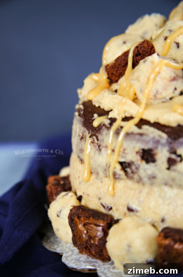 The Ultimate Brownie & Cookie Dough Freak Cake 3 Close-up of fluffy, safe to eat cookie dough frosting on a cake slice
