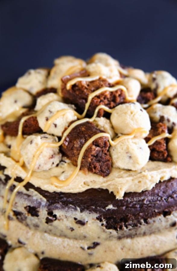The Ultimate Brownie & Cookie Dough Freak Cake 5 An elaborate Brownie Cookie Dough Freak Cake, showcasing all its layered components