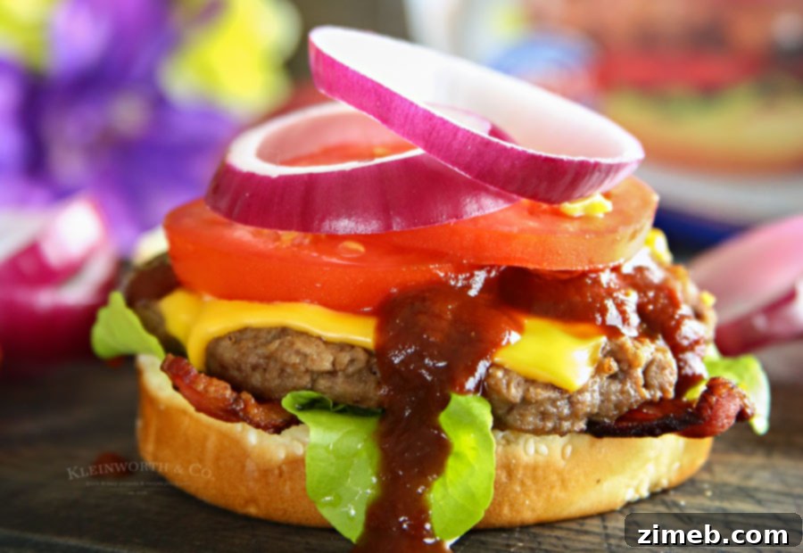 Smoky BBQ Bacon Steakhouse Burger 3 Close-up of a Steakhouse Burger with melted cheese and fresh ingredients