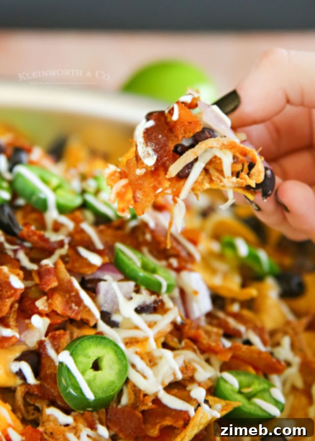 Ultimate Smoked BBQ Bacon Nachos 5 Smoked BBQ Bacon Nachos fresh off the grill, ready to serve.