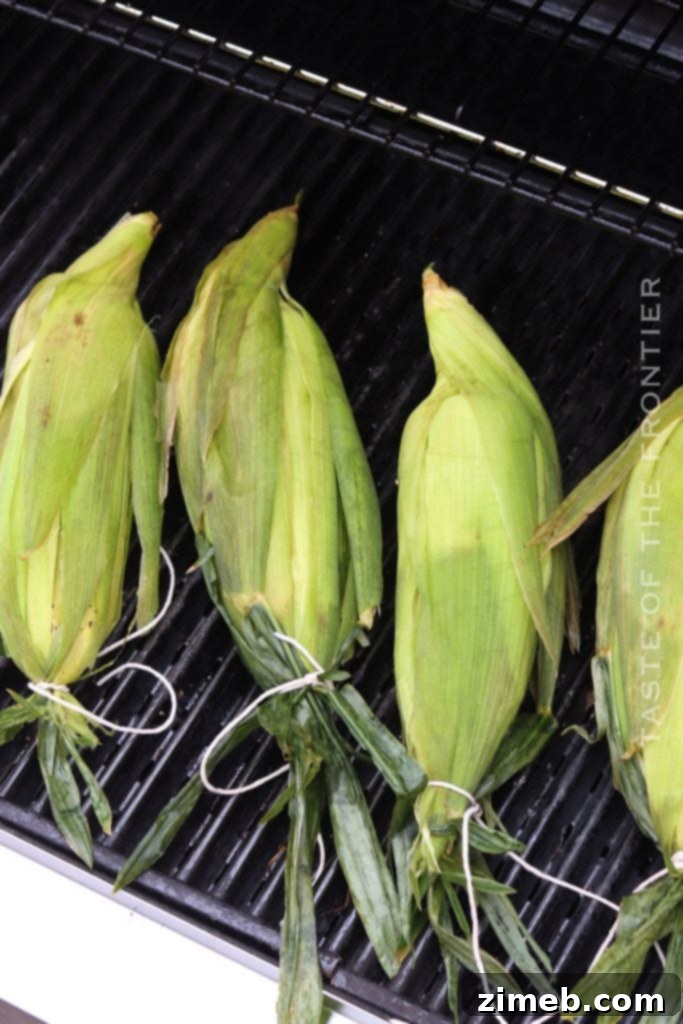 Ember-Kissed Corn 9 Corn on the cob cooking in a smoker