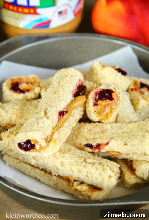Peanut Butter and Jelly Pinwheels 6 A plate of creative Peanut Butter & Jelly Roll-Up Sandwiches
