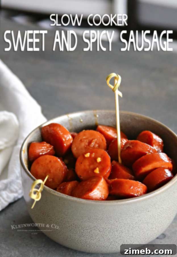 Sticky Sweet and Spicy Slow Cooker Sausage 11 Slow Cooker Sweet & Spicy Sausage ready to be served from a slow cooker at a gathering.