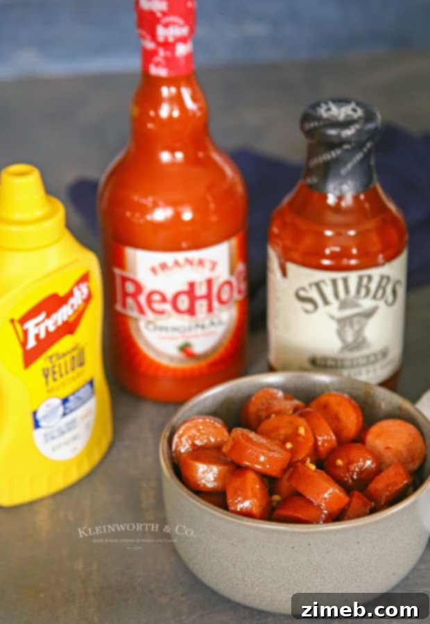 Sticky Sweet and Spicy Slow Cooker Sausage 3 Close-up of Slow Cooker Sweet & Spicy Sausage recipe, showcasing the rich, glossy sauce and savory sausage pieces.