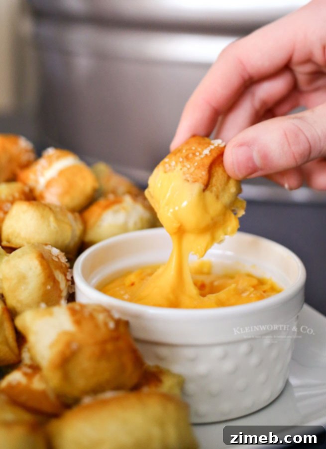 Sticky Sweet and Spicy Slow Cooker Sausage 10 Soft pretzel bites served with a cheesy dipping sauce.