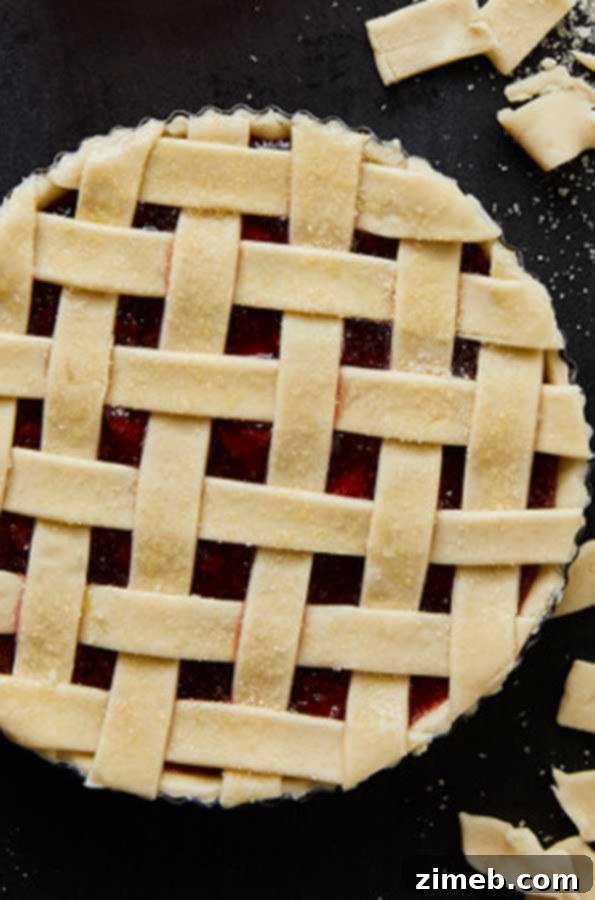 Close-up of golden Air Fryer Cherry Pie with bubbly filling
