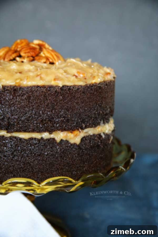 German Chocolate Cake Perfection 4 Side view of a sliced German Chocolate Cake with coconut pecan frosting