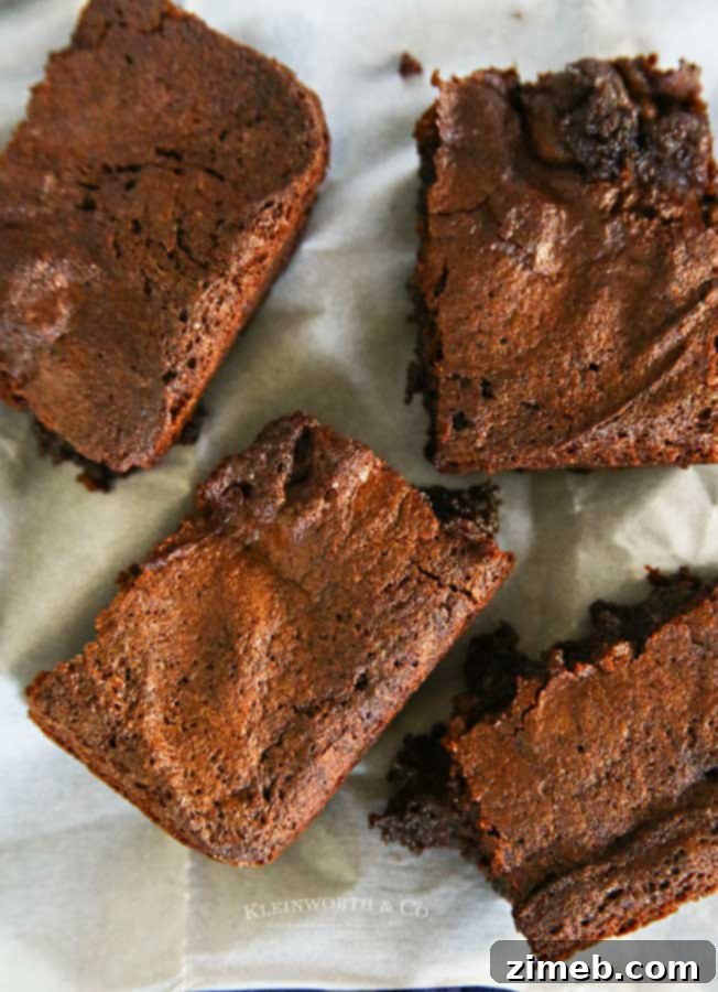 Fudgy Air Fryer Brownies 4 Stack of thick and chewy Air Fryer Brownies on a plate