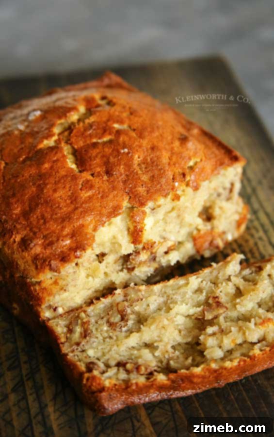 Effortless Air Fryer Banana Bread 3 Close-up of freshly baked Air Fryer Banana Bread recipe, showing a moist texture and nutty crust.