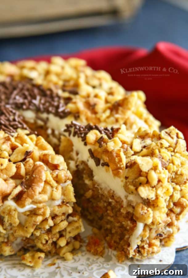 Freshly baked Slow Cooker Carrot Cake with cream cheese frosting, garnished with walnuts.
