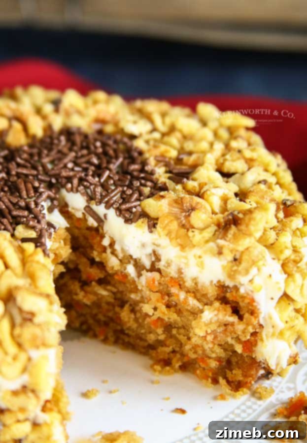 Crockpot - Slow Cooker Carrot Cake garnished with frosting and walnuts.