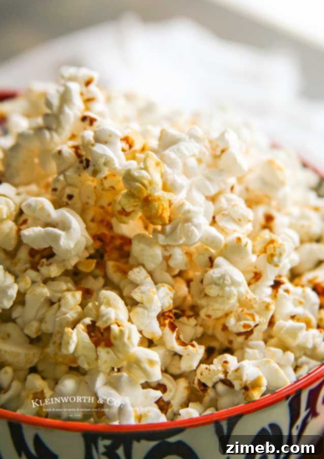 Stovetop Sweet & Salty Popcorn 4 Homemade kettle corn popping in a paper bag in the microwave