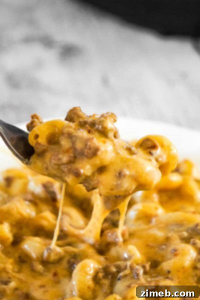 SUPER CHEESY Instant Pot Bacon Cheeseburger Pasta – The ultimate comfort food mashup: bacon cheeseburger flavors infused into a creamy pasta dish.