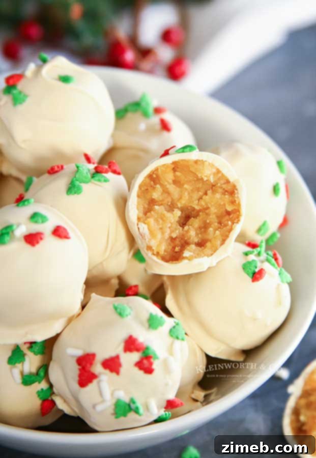Delicious Sugar Cookie Truffles recipe with white chocolate coating and sprinkles.