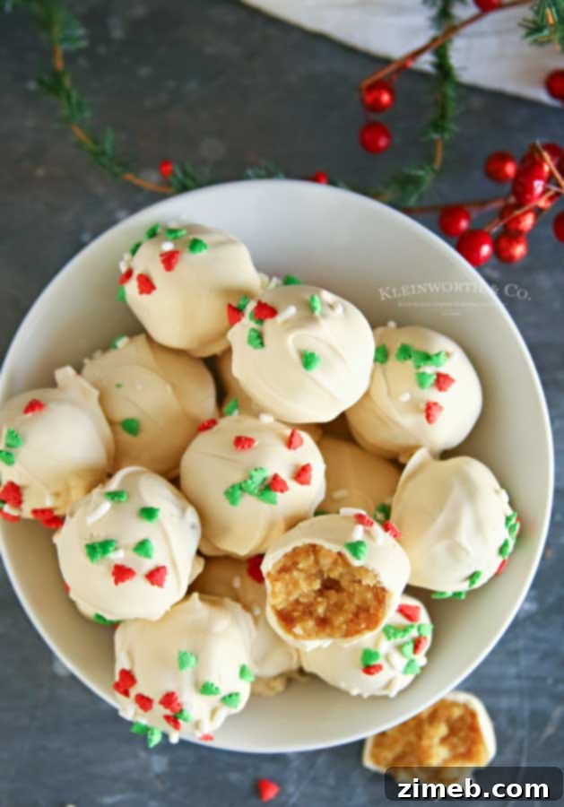 Christmas Sugar Cookie Truffles adorned with festive holiday sprinkles.