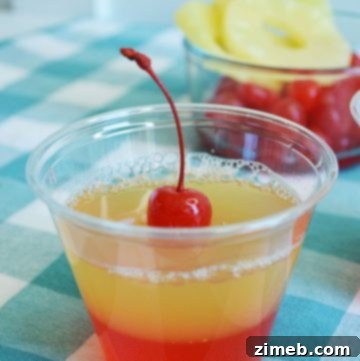 PINEAPPLE UPSIDE DOWN JELLO SHOTS with cherry