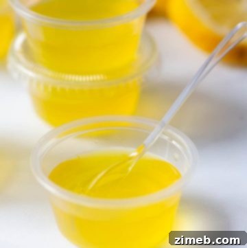 Lemon Drop Jello Shots garnished with lemon twist