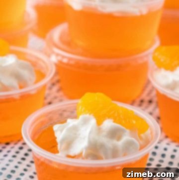 Creamsicle Orange Jello Shots topped with whipped cream
