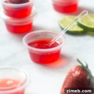 Very Berry Strawberry Daiquiri Jello Shots with berries
