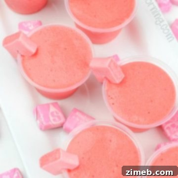 Pink Starburst Jello Shots with candy garnish