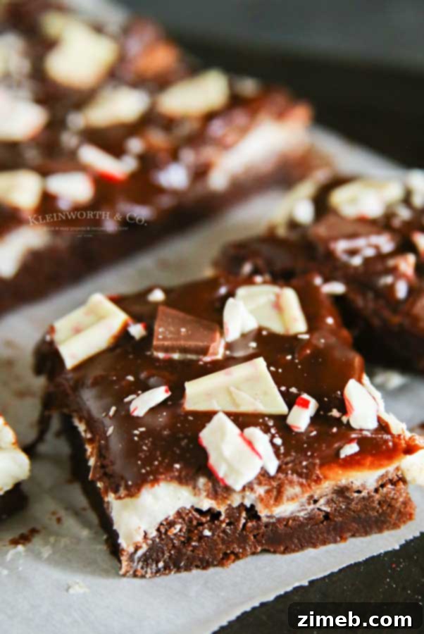 Snow-Kissed Peppermint Bark Brownies 4 Chocolate Ganache -Frosted Peppermint Bark Brownies with a silky smooth ganache layer