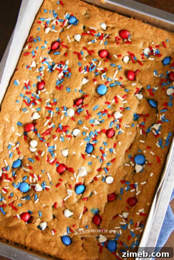 Patriotic MMs Cookie Bars 3 A close-up of buttery, soft, and chewy Patriotic M&M's Cookie Bars, ideal for any patriotic holiday