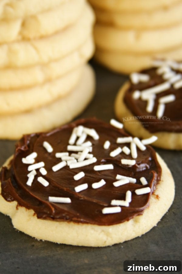 Perfect Sugar Cookies with Just 4 Ingredients 5 chocolate frosted sugar cookies, made with 4 ingredients, stacked