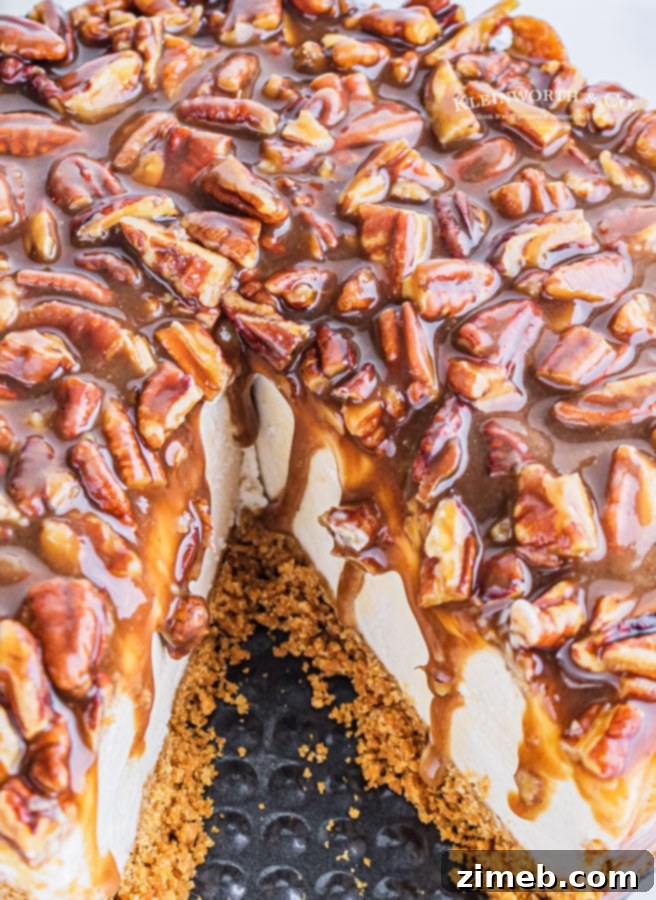 Ultimate No-Bake Pecan Pie Cheesecake 15 taking a slice of holiday cheesecake