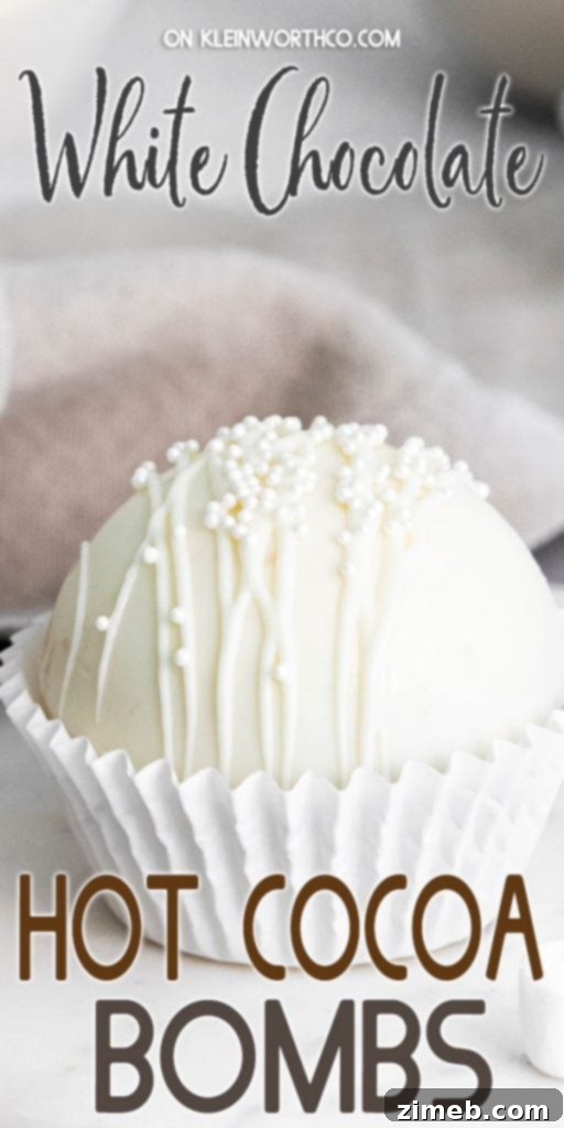 Mug-Melting Cocoa Surprises 17 White Chocolate Hot Cocoa Bombs decorated with white chocolate drizzles
