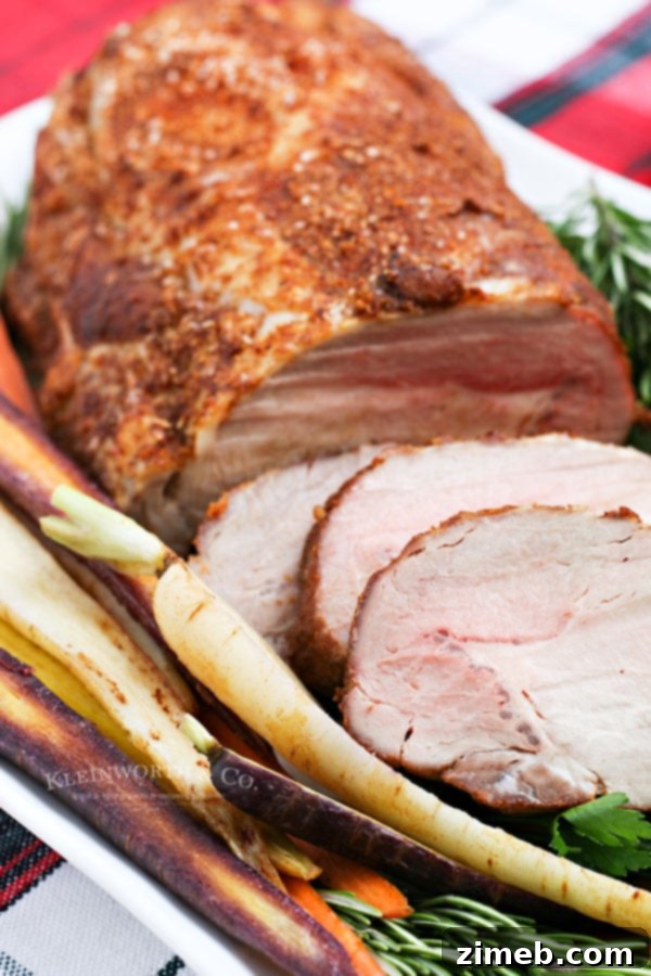 Succulent Pork Loin 4 A festive holiday dinner featuring a succulent pork loin roast, ready to be enjoyed.