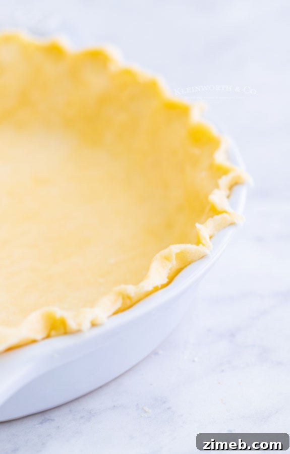 The Ultimate Pumpkin Pie 8 fluted pie crust before baking